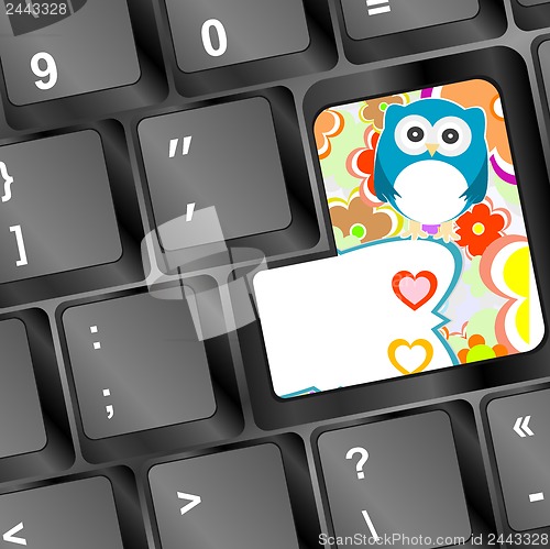 Image of owl on computer keyboard key with love hearts and flowers