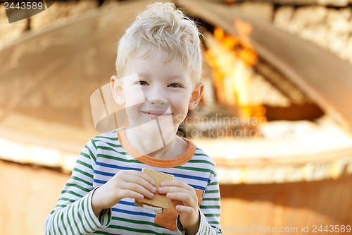 Image of boy eating smores