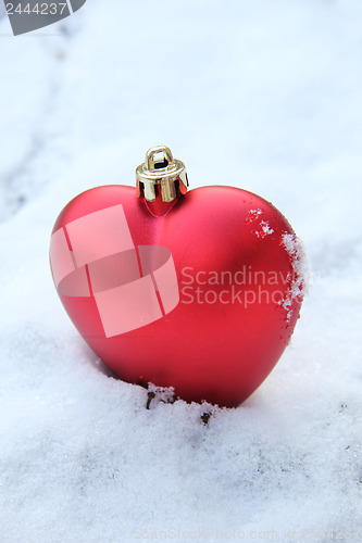 Image of Heart shaped ornament in the snow