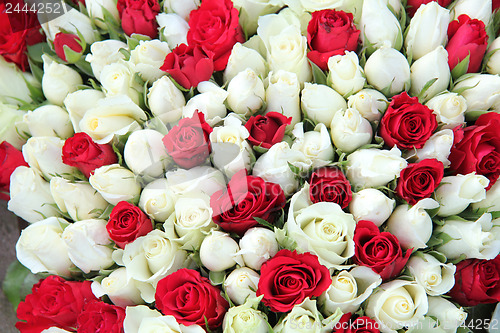 Image of Red and white roses in a bridal bouquet