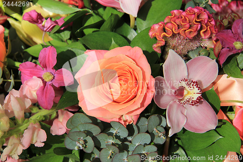 Image of Orchids and roses in bridal bouquet