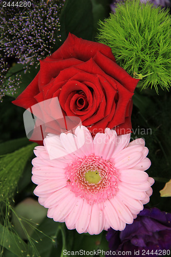 Image of Wedding arrangement in red, pink and purple