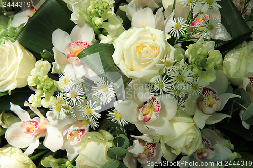 Image of Orchids and roses in bridal bouquet
