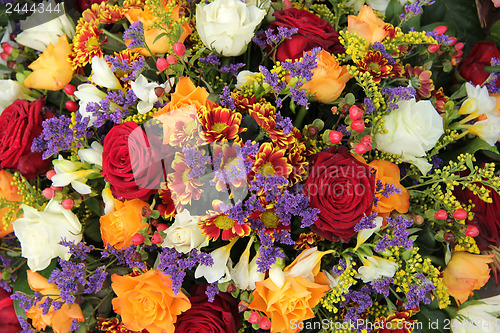 Image of Mixed floral arrangement in yellow, red and white