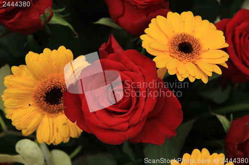 Image of yellow and red flowers in a bridal arrangement