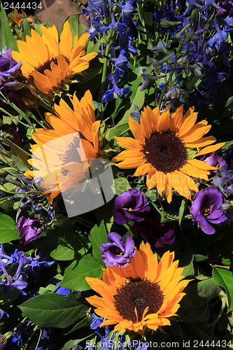 Image of Sunflowers and purple eustoma