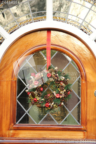 Image of Stained glass window with a wreath