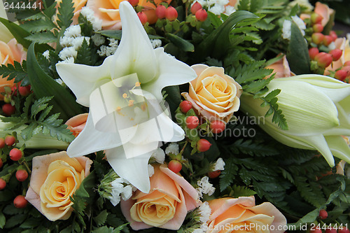 Image of Roses and lillies in a bridal arrangement