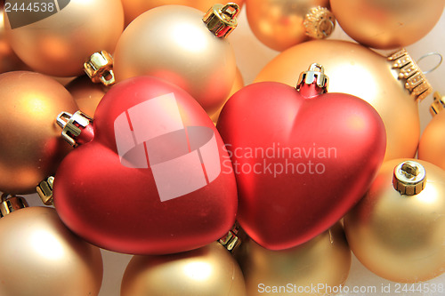 Image of red heart shaped christmas ornaments