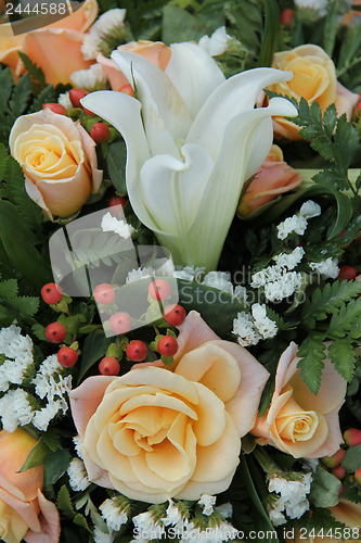 Image of Roses and lillies in a bridal arrangement