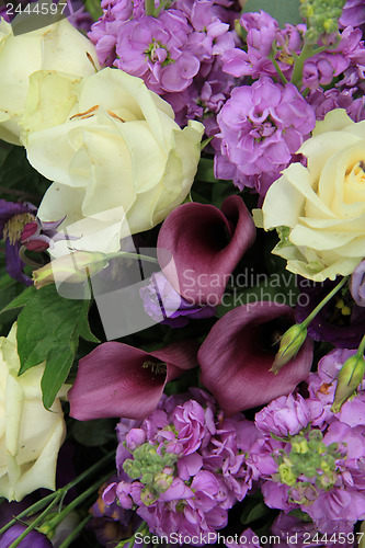 Image of Purple and white bridal arrangement