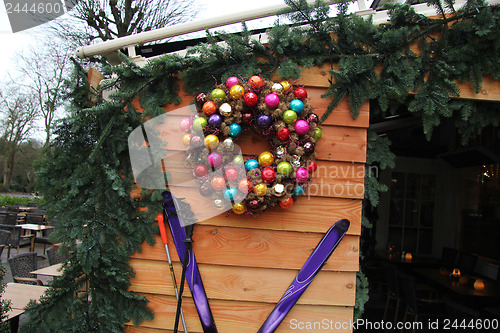 Image of Log cabin with christmas decorations