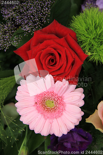 Image of Wedding arrangement in red, pink and purple