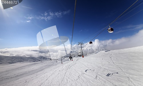 Image of Gondola and chair lift in nice sunny day.