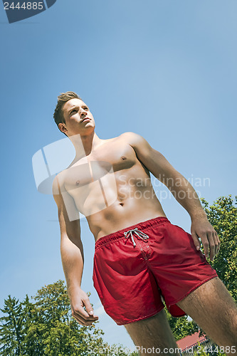 Image of Young man in swimming shorts