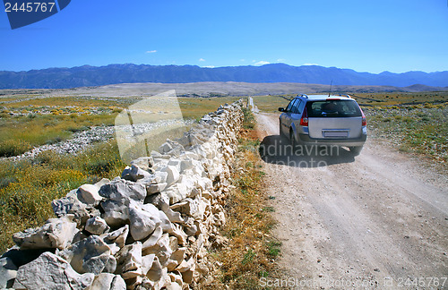 Image of Field road with car 