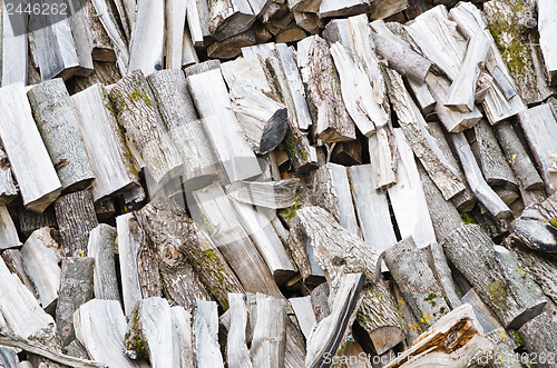 Image of folded rows of firewood, close-up  