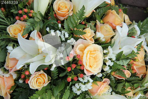 Image of Roses and lillies in a bridal arrangement