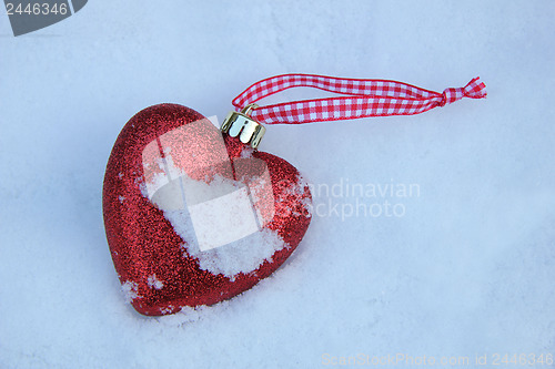 Image of Heart shaped ornament in the snow