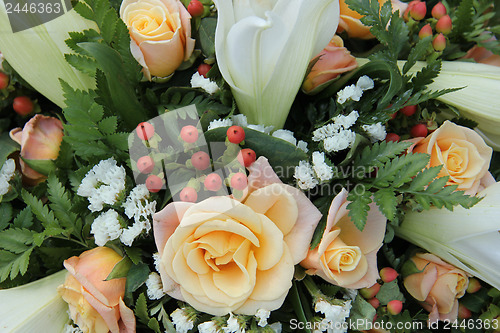 Image of Roses and lillies in a bridal arrangement