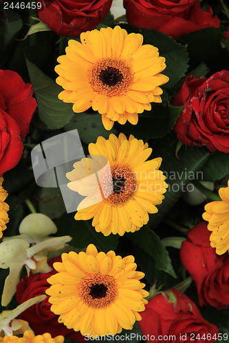 Image of yellow and red flowers in a bridal arrangement
