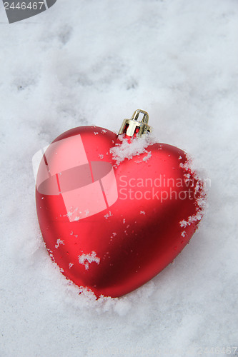 Image of Heart shaped ornament in the snow