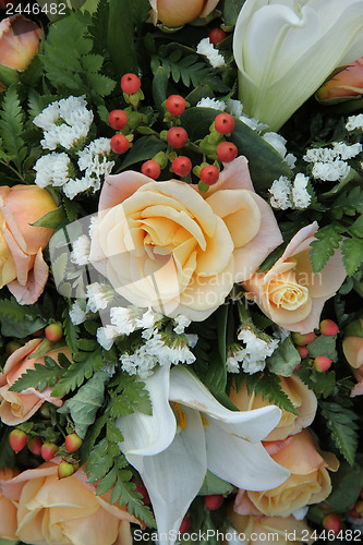 Image of Roses and lillies in a bridal arrangement