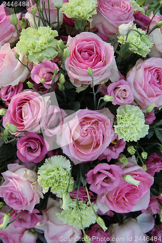 Image of Roses and carnations in bridal bouquet