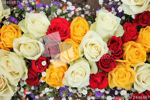 Image of Yellow, white and red roses in a wedding arrangement