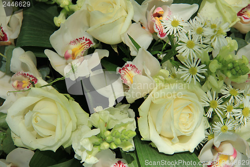 Image of Orchids and roses in bridal bouquet