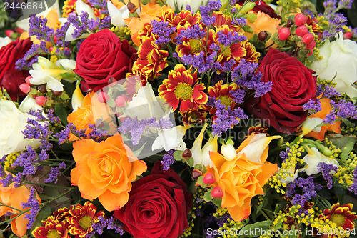 Image of Mixed floral arrangement in yellow, red and white