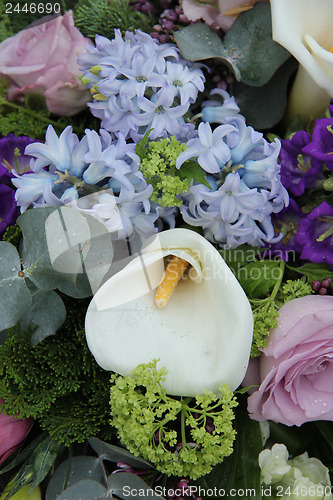 Image of Calla lily in a blue purple arrangement