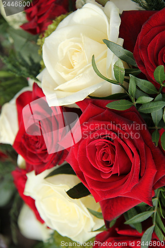 Image of Red and white roses in a bridal bouquet