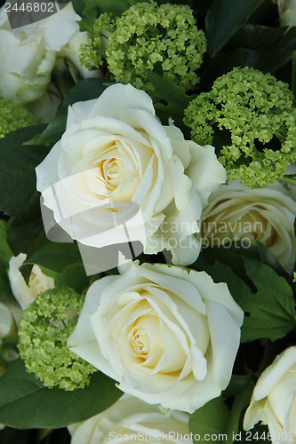 Image of White and green wedding arrangement