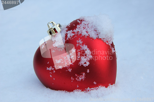 Image of Heart shaped ornament in the snow