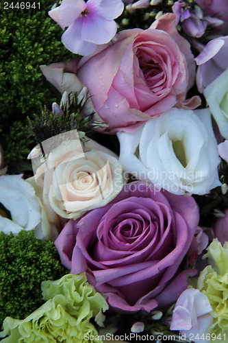 Image of purple, pink and white wedding centerpiece