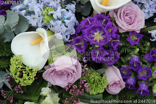 Image of Calla lily in a blue purple arrangement