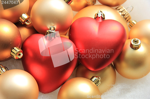 Image of red heart shaped christmas ornaments