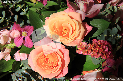 Image of Orchids and roses in bridal bouquet