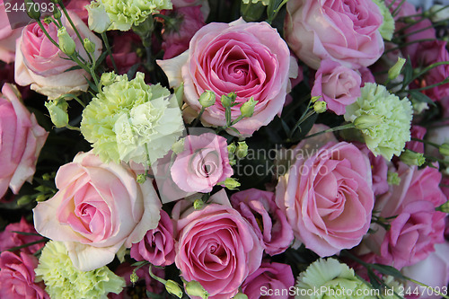 Image of Roses and carnations in bridal bouquet