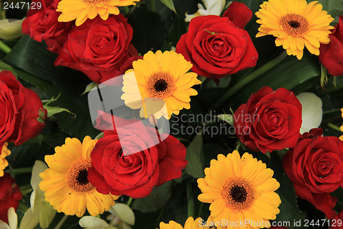 Image of yellow and red flowers in a bridal arrangement