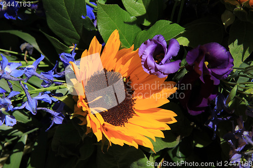 Image of Sunflowers and purple eustoma