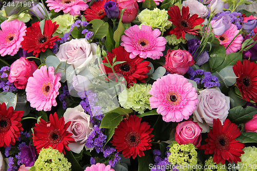 Image of Wedding arrangement in red, purple and pink