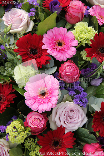 Image of Wedding arrangement in red, purple and pink