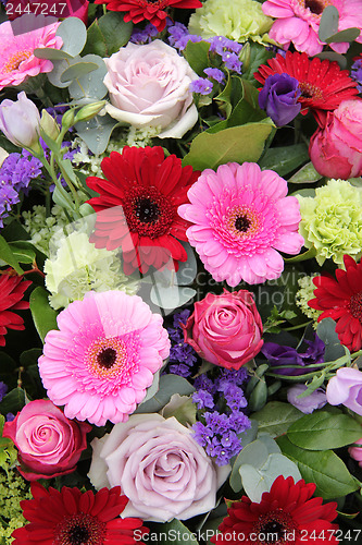 Image of Wedding arrangement in red, purple and pink