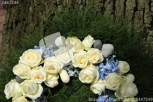 Image of White roses on a sympathy wreath
