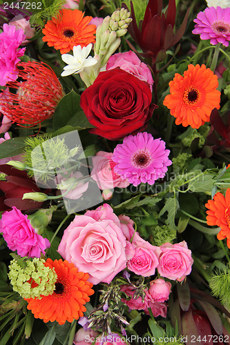 Image of Flower arrangement in pink, red and orange