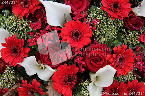 Image of Floral arrangement in red and white