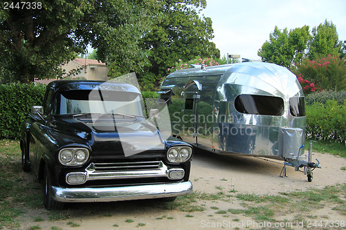 Image of Classic car and caravan