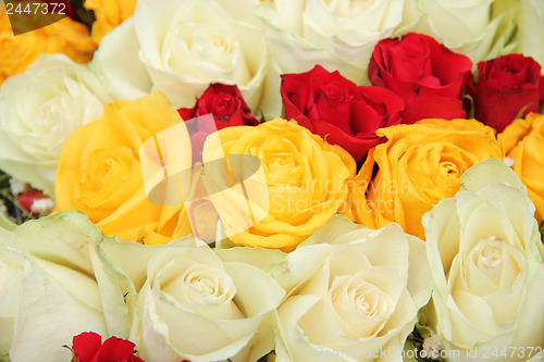 Image of Yellow, white and red roses in a wedding arrangement